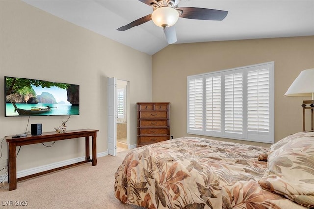 carpeted bedroom with vaulted ceiling, a ceiling fan, and baseboards