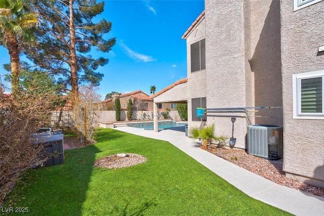 view of yard with central air condition unit, a fenced in pool, and a fenced backyard