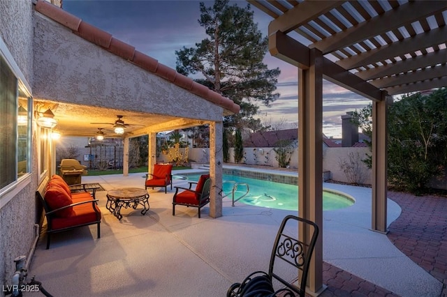 view of patio with a fenced in pool, a fenced backyard, a ceiling fan, and a pergola