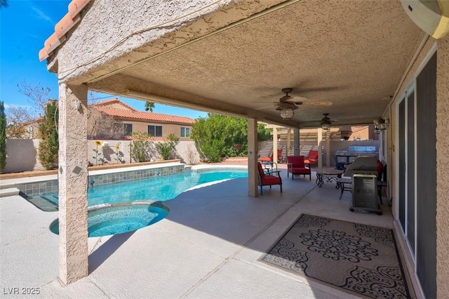 view of swimming pool featuring a patio, a fenced backyard, a ceiling fan, and a pool with connected hot tub