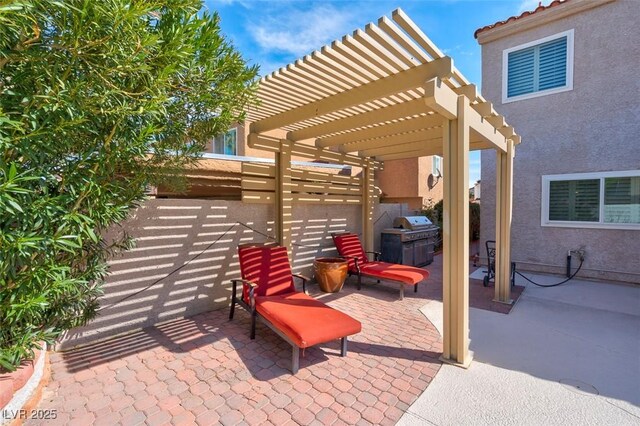 view of patio / terrace with a pergola and a fenced backyard