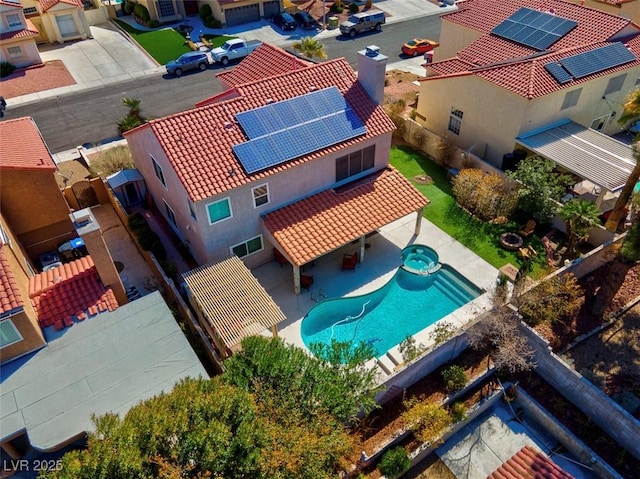 birds eye view of property with a residential view