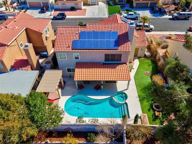 birds eye view of property with a residential view