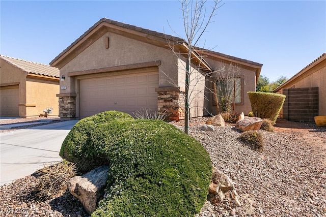 view of property exterior with stucco siding, stone siding, a garage, and concrete driveway