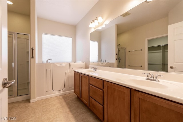 full bath featuring double vanity, a stall shower, a bath, and a sink