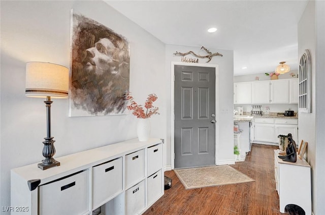 entrance foyer featuring recessed lighting and dark wood finished floors