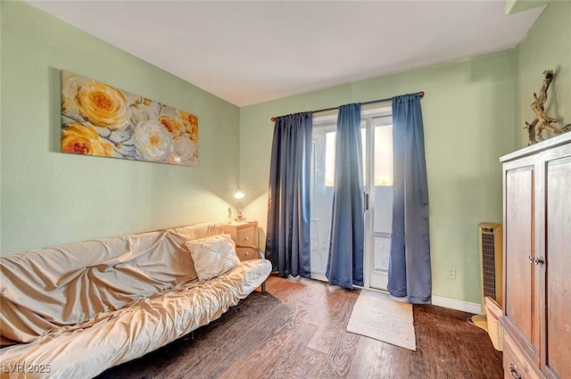 living area featuring wood finished floors and baseboards