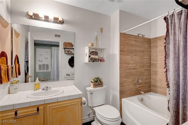 bathroom with vanity, toilet, and shower / bath combo with shower curtain