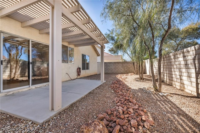 view of yard with a patio, a fenced backyard, and a pergola