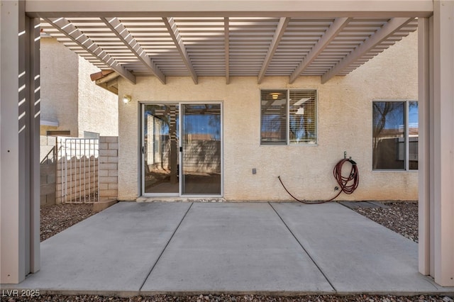 view of patio with fence and a pergola