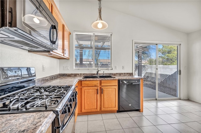 kitchen featuring a sink, black appliances, light tile patterned floors, and vaulted ceiling