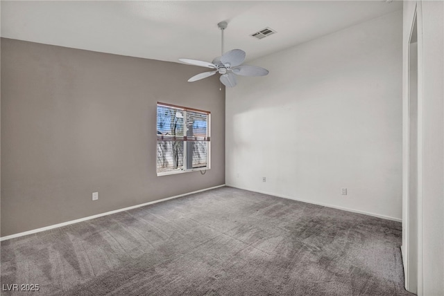 carpeted empty room with visible vents, baseboards, lofted ceiling, and ceiling fan