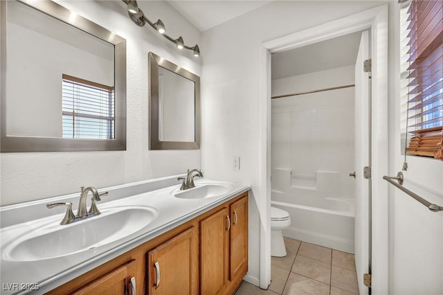 full bath with tile patterned floors, toilet, double vanity, and a sink