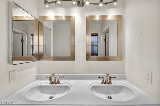 bathroom with a sink and double vanity