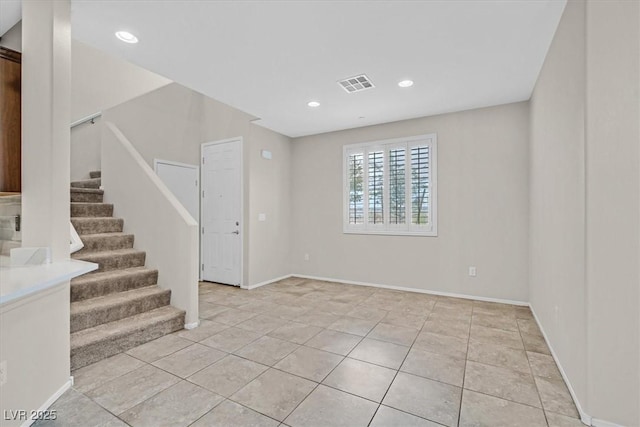 interior space with visible vents, recessed lighting, stairway, light tile patterned flooring, and baseboards