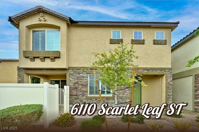6110 Scarlet Leaf St, Las Vegas, NV 89148 - view of front facade with stucco siding and stone siding