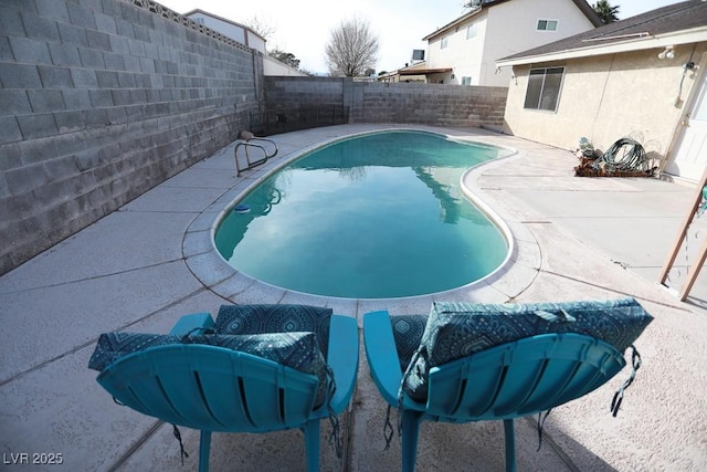 view of pool featuring a fenced in pool, a fenced backyard, and a patio area