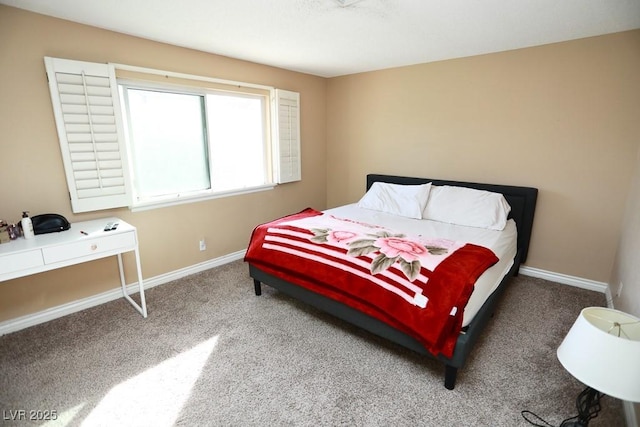 carpeted bedroom with baseboards