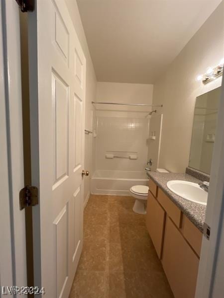 bathroom with toilet, vanity, and shower / bathing tub combination