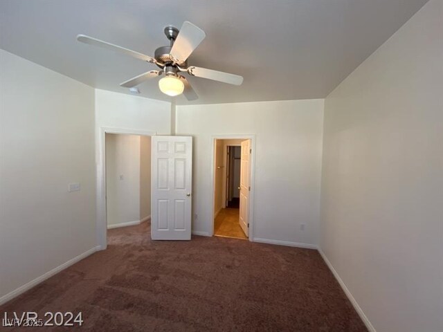 unfurnished bedroom featuring baseboards, a ceiling fan, and carpet flooring