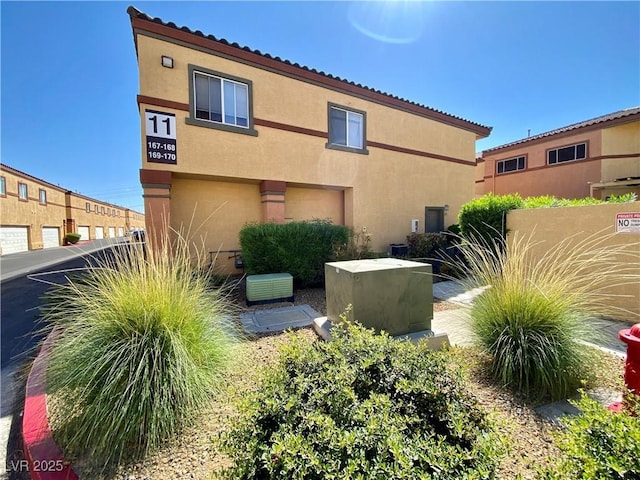 rear view of property with stucco siding