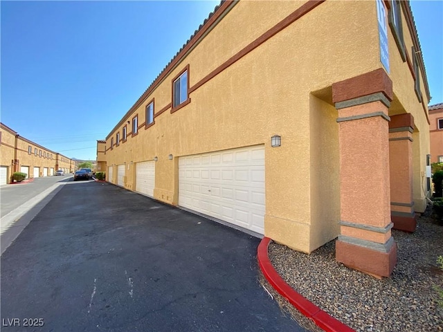 exterior space featuring stucco siding