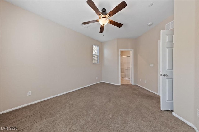 unfurnished bedroom featuring visible vents, baseboards, ensuite bath, and carpet flooring