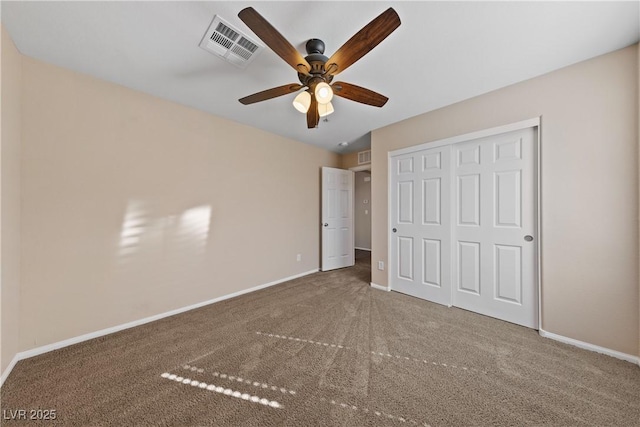 unfurnished bedroom with visible vents, baseboards, and carpet flooring