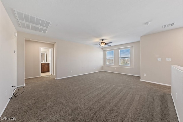 unfurnished room featuring visible vents, baseboards, and ceiling fan