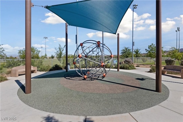 view of playground featuring fence