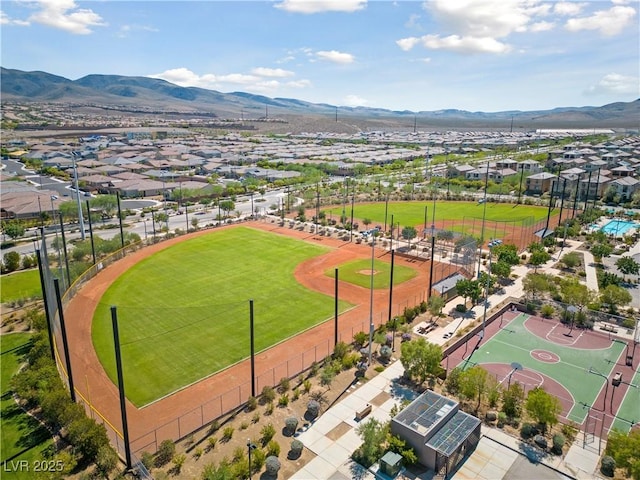 birds eye view of property featuring a mountain view and a residential view