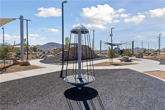 community playground with a mountain view