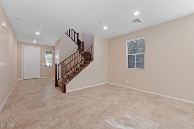 unfurnished room featuring stairway, recessed lighting, visible vents, and baseboards