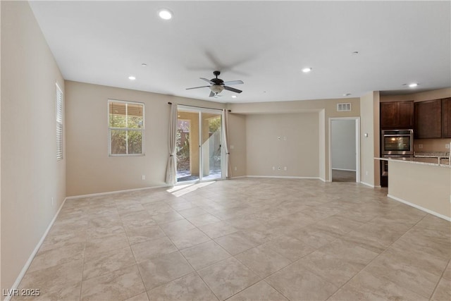 unfurnished living room featuring recessed lighting, visible vents, baseboards, and a ceiling fan