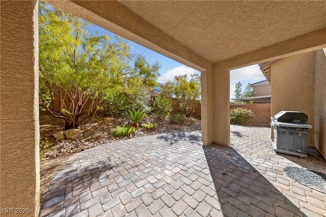 view of patio / terrace featuring area for grilling and a fenced backyard