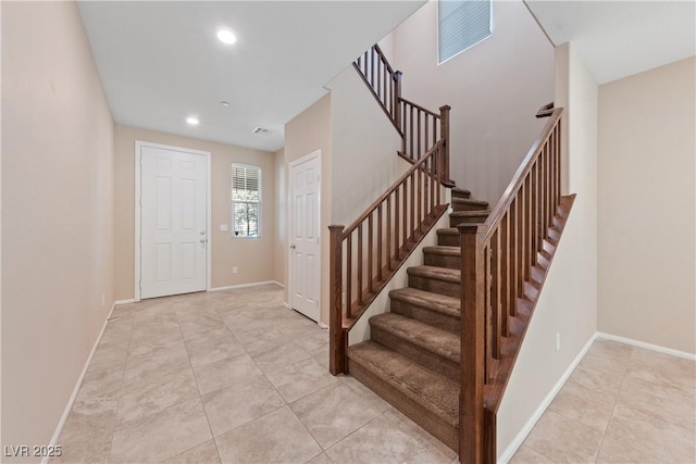 entrance foyer featuring recessed lighting, visible vents, baseboards, and light tile patterned floors