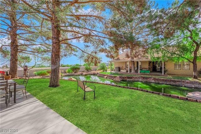 view of yard featuring a water view and a patio area