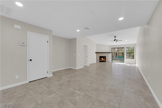 7803 Canoe Ln, Las Vegas, NV 89145 - unfurnished living room with a ceiling fan, a tile fireplace, and recessed lighting