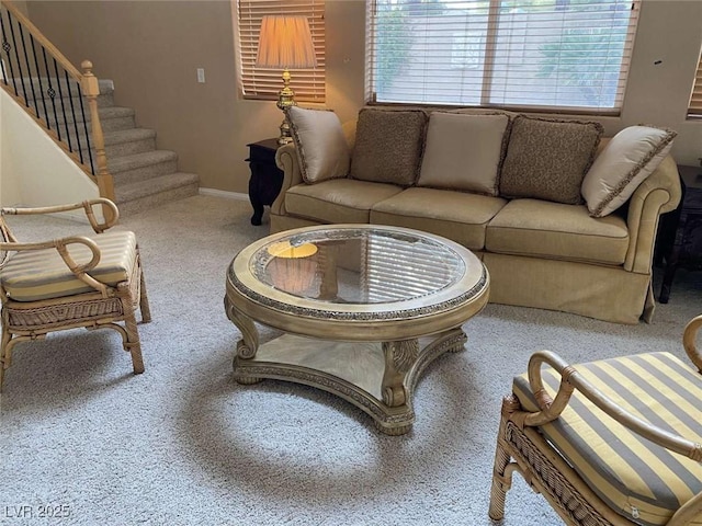 living room featuring stairway, carpet flooring, and baseboards