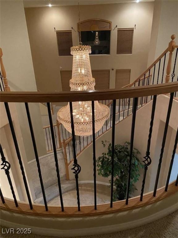 9301 Harrow Rock St, Las Vegas, NV 89143 - stairway with a chandelier, carpet flooring, and baseboards
