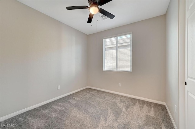 carpeted spare room with a ceiling fan, baseboards, and visible vents