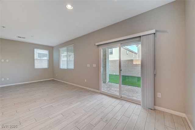 spare room with recessed lighting, visible vents, baseboards, and light wood finished floors