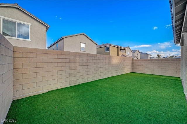 view of yard featuring a fenced backyard