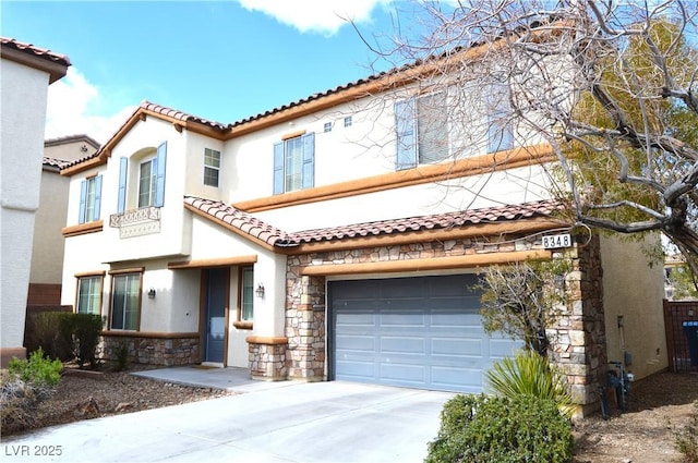 mediterranean / spanish-style house featuring stucco siding, stone siding, concrete driveway, and an attached garage