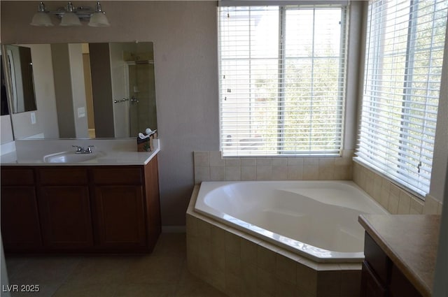 bathroom featuring vanity, tile patterned floors, a bath, and a stall shower