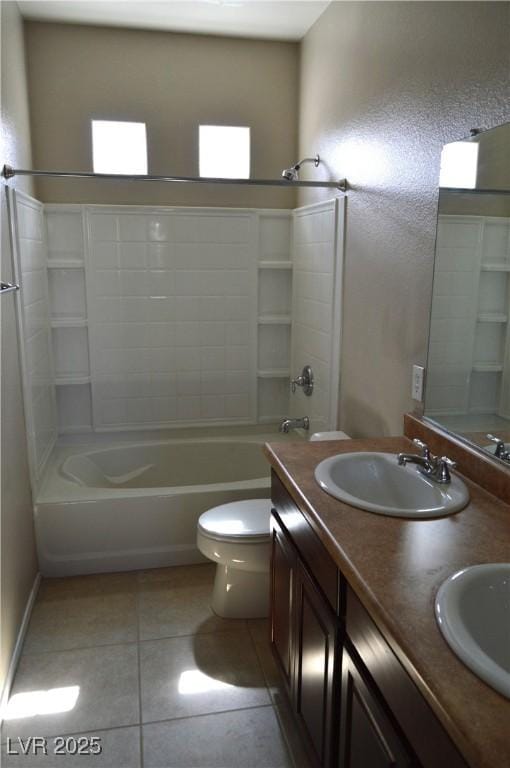 bathroom featuring a sink, toilet, bathtub / shower combination, and tile patterned flooring