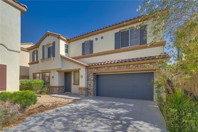 8348 Mokena Ave, Las Vegas, NV 89178 - mediterranean / spanish house featuring stone siding, stucco siding, an attached garage, concrete driveway, and a tile roof