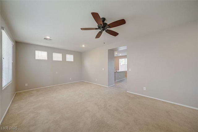 8348 Mokena Ave, Las Vegas, NV 89178 - unfurnished room featuring light carpet, ceiling fan, healthy amount of natural light, and recessed lighting