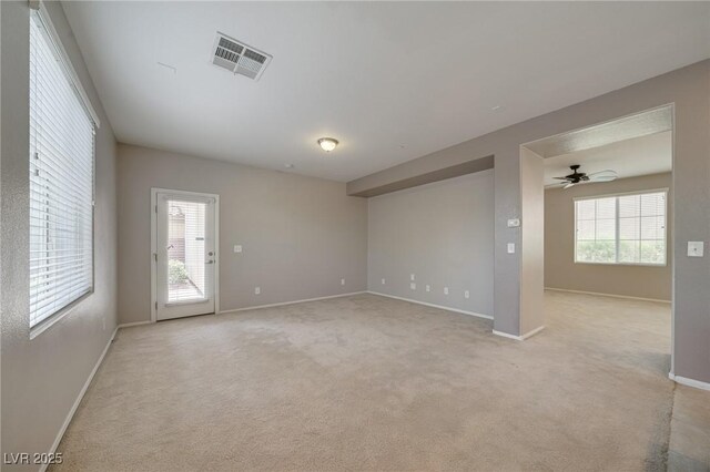 8348 Mokena Ave, Las Vegas, NV 89178 - unfurnished room with light colored carpet, baseboards, and ceiling fan