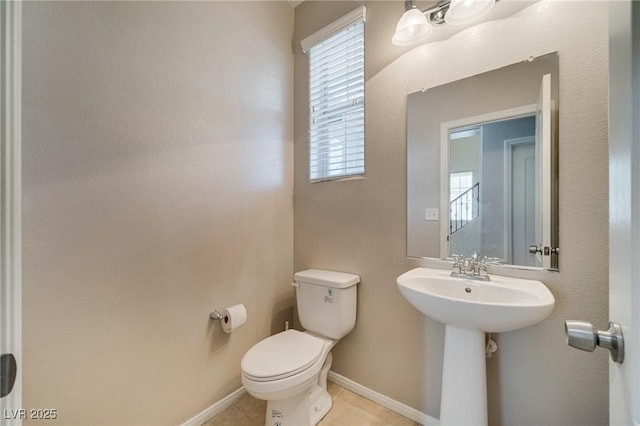 8348 Mokena Ave, Las Vegas, NV 89178 - bathroom featuring toilet, tile patterned flooring, and baseboards